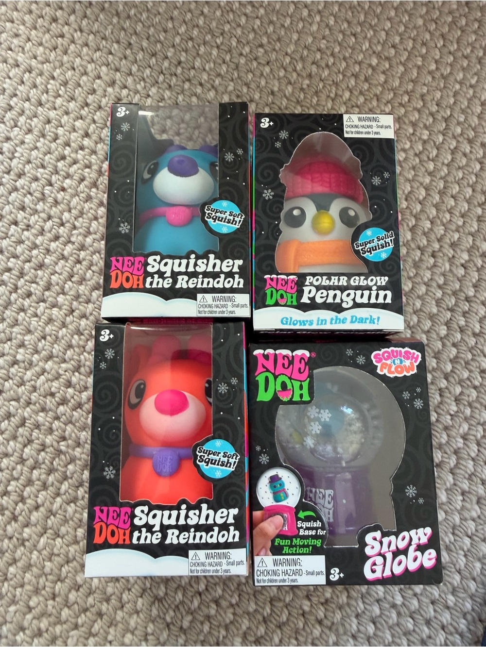 NeeDoh Polar Glow Penguin & Squisher Reindoh Plush Toy Set - Blue, Orange, Pink